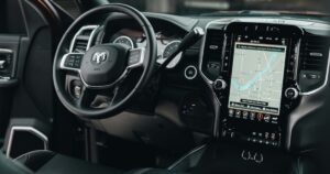 The inside of a RAM vehicle with a giant touch screen navigation instillation