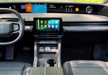 The inside of a car showing an upgraded control unit system