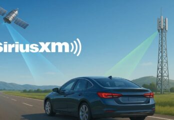 A satellite and radio tower sending waves to a vehicle on a road